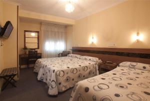 Кровать или кровати в номере Hotel Castilla