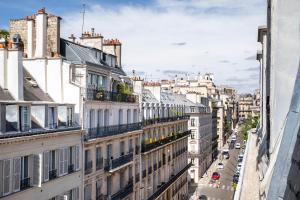 a view of a city street with buildings at Hôtel des Champs-Elysées in Paris