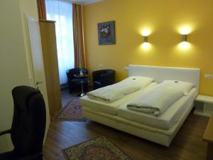 Postel nebo postele na pokoji v ubytování Hotel Alte Post