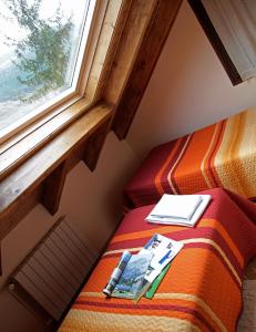 A bed or beds in a room at Casa Rural la Comella