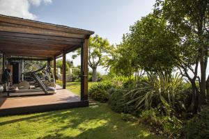 a garden with a pavilion with a golf cart in it at Monastero Santa Rosa Hotel & Spa in Conca dei Marini