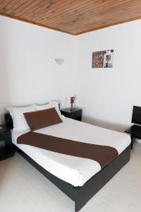 Postel nebo postele na pokoji v ubytování Zomatel Hotel