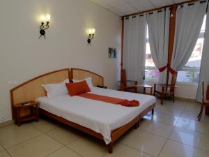 Postel nebo postele na pokoji v ubytování Zomatel Hotel