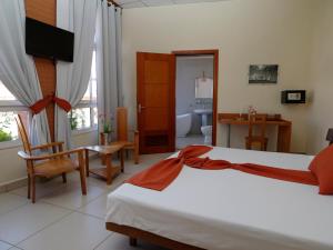 Postel nebo postele na pokoji v ubytování Zomatel Hotel