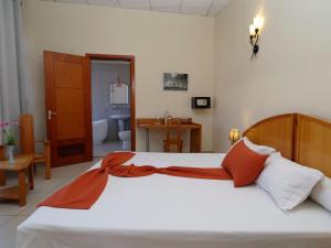 Postel nebo postele na pokoji v ubytování Zomatel Hotel