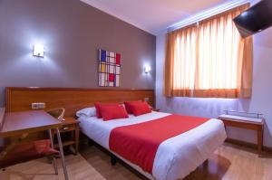 Cama o camas de una habitación en Hostal Persal