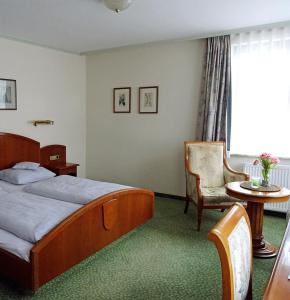 Postel nebo postele na pokoji v ubytování Hotel Eberbacher Hof