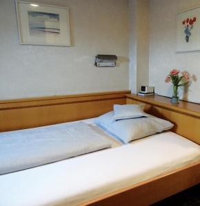 Postel nebo postele na pokoji v ubytování Hotel Eberbacher Hof