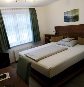 Postel nebo postele na pokoji v ubytování Hotel Eberbacher Hof