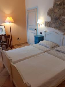 Katil atau katil-katil dalam bilik di Dimora del Sole