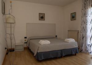 A bed or beds in a room at Bed and Breakfast La Sosta