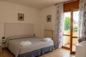 A bed or beds in a room at Bed and Breakfast La Sosta