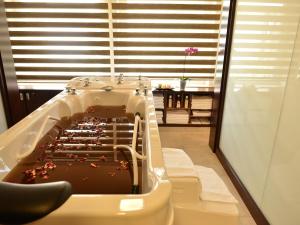a bath tub filled with lots of chocolate at EA Hotel Elefant in Karlovy Vary