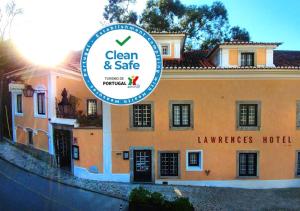 a building with a sign in front of it at Lawrences Hotel in Sintra