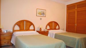 Postel nebo postele na pokoji v ubytování Hotel Antonio Conil