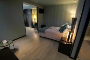 Postel nebo postele na pokoji v ubytování Hotel Torre de Núñez