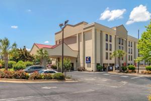 a large building with a parking lot in front of it at Comfort Inn & Suites in Athens