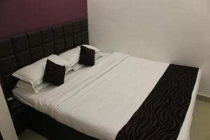 Postel nebo postele na pokoji v ubytování Hotel Fortune