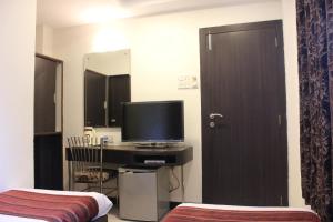 TV a/nebo společenská místnost v ubytování Hotel Fortune