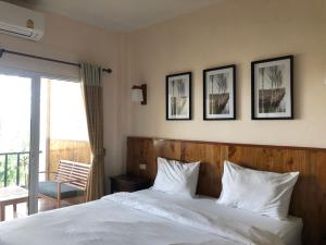 Postel nebo postele na pokoji v ubytování มิตรภาพโฮเทล ( Mittrapap Hotel )