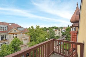 a balcony with a view of a city at Victus Apartamenty, Apartamenty Panamera in Sopot