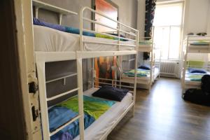 a group of bunk beds in a room at Onefam Home in Prague