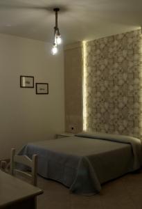 Ένα ή περισσότερα κρεβάτια σε δωμάτιο στο Masseria Don Sante