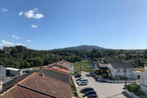 an aerial view of a small town with cars parked at Barcelos Views in Barcelos