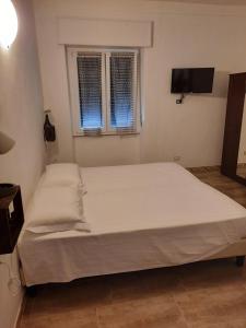 Postel nebo postele na pokoji v ubytování B&B Confine