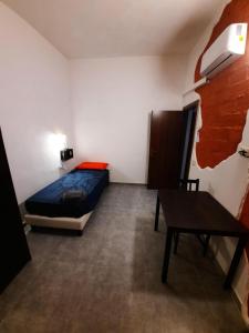 Postel nebo postele na pokoji v ubytování B&B Confine