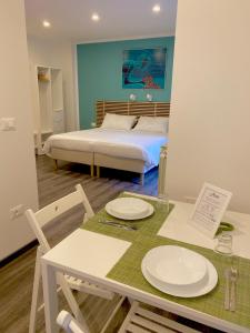 Postel nebo postele na pokoji v ubytování Mimì Rooms&Studios