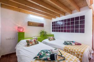 Ein Bett oder Betten in einem Zimmer der Unterkunft Casa Drago - Villa Perenquén