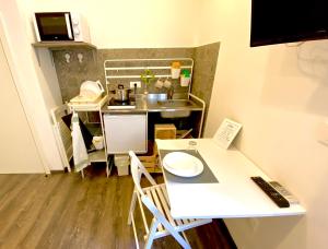 Kuchyň nebo kuchyňský kout v ubytování Mimì Rooms&Studios