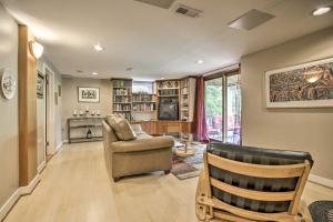 a living room with a couch and a chair at Harpers Ferry Apartment with Private Pool and Hot Tub! in Harpers Ferry