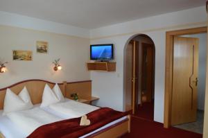 Łóżko lub łóżka w pokoju w obiekcie Landhaus Montana