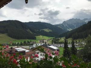 a view of a town in a valley with mountains at Landhaus Montana in Gerlos