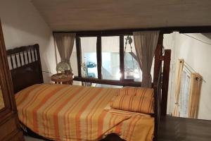 a bedroom with a bed and a window at Havre picard entre Amiens et Baie de Somme in Allery