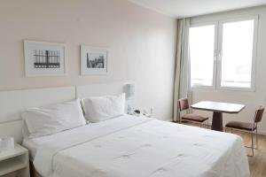 Cama ou camas em um quarto em Plaza São Rafael Hotel