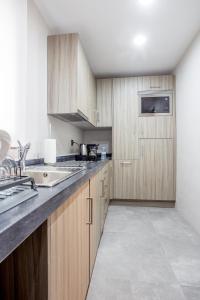 Η κουζίνα ή μικρή κουζίνα στο Makass Appart Hotel
