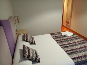Postel nebo postele na pokoji v ubytování Descanso do Sar