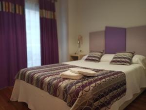 Postel nebo postele na pokoji v ubytování Descanso do Sar
