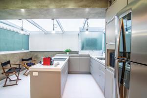 Kuchyň nebo kuchyňský kout v ubytování 360 Perdizes