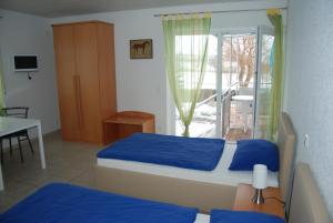 Ένα ή περισσότερα κρεβάτια σε δωμάτιο στο Ferienwohnungen Schäfer