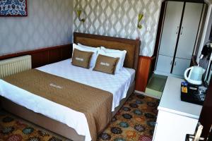 Кровать или кровати в номере Aspawa Hotel