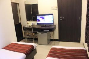TV a/nebo společenská místnost v ubytování Hotel Fortune