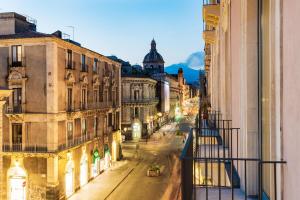 a view of a city street at night at Meo Design Suites & Spa in Catania
