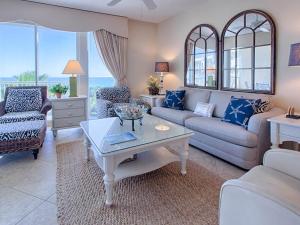 a living room with a couch and a table at Crescent III in Destin