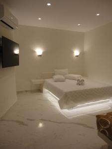 Łóżko lub łóżka w pokoju w obiekcie Triena Apartments