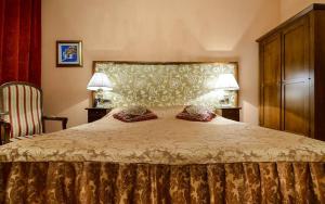 a bedroom with a large bed and a large window at Hamlet Bed & Breakfast in Dubrovnik