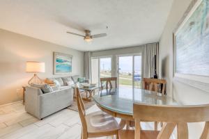 a living room with a table and a couch at Windancer Condominiums in Destin